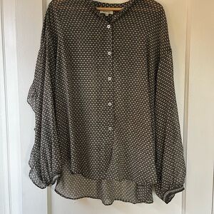 Semi-sheer bohemian ruffle button-up blouse.